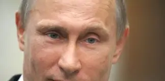 Russia's President Vladimir Putin speaks to journalists in the Belarus capital Minsk, on April 29, 2014, after attending a session of the Supreme Eurasian Economic Council . Putin warned yesterday that new EU and US sanctions could impact the work of Western energy firms in Russia and denied there were any Kremlin forces in eastern Ukraine. AFP PHOTO/ RIA-NOVOSTI/ POOL / ALEXEY DRUZHININ