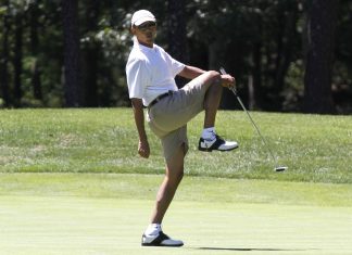 President Barack Obama reacts as he misses a shot while golfing on the first hole at Farm Neck Golf Club in Oak Bluffs, Mass., on the island of Martha's Vineyard on Sunday, Aug. 11, 2013. (AP Photo/Jacquelyn Martin)