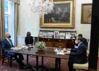 Double-masked Biden gives Japan’s Prime Minister a burger and fries