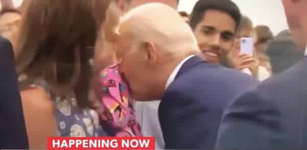 NextImg:Biden Terrorizes a Baby with Licking/Nibbling Spree
