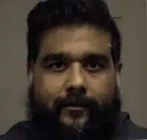 Why Is Ali Alibhai Teaching, Getting Arrested & Suing When He’s a Guest in the USA